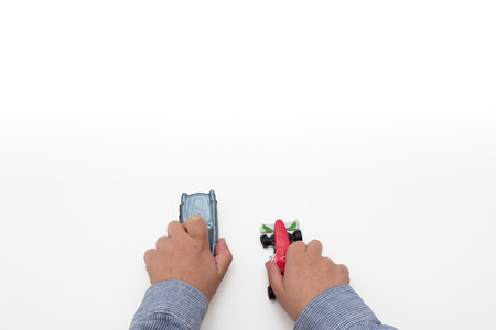 boy playing with cars - hands isolated on white backgroundの写真素材