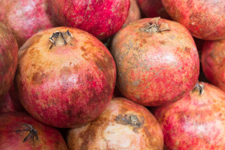 many pomegranates background - grenadine fruit background