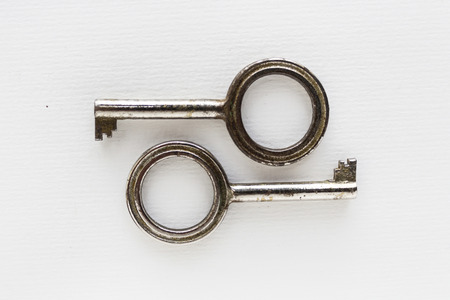 pair of keys on white background - vintage objects