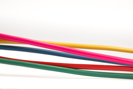 colored cables on white background - network conceptの写真素材