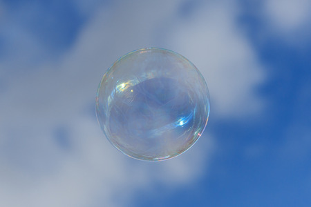 soap bubble on blue sky - floating bubbleの写真素材