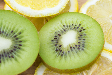 sliced kiwi and lemon fruit slices closeupの写真素材