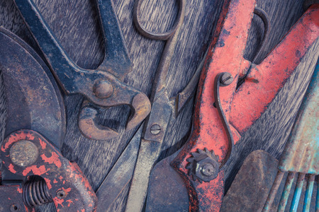 Old rusty tools - vintage tools closeup on wooden background