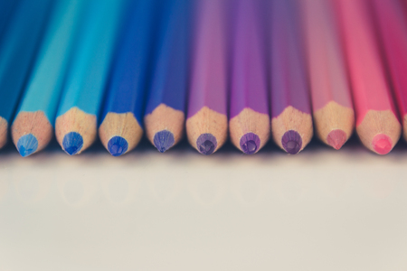group of color pencils in a rowの写真素材