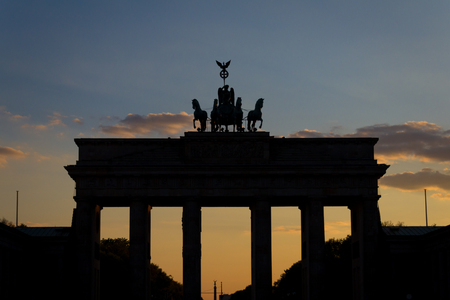 Silhouette of the Brandenburg gate (Brandenburger Tor) at sunsetの写真素材