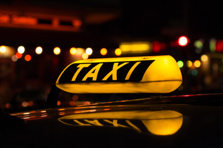 taxi sign at night - taxi carsの写真素材