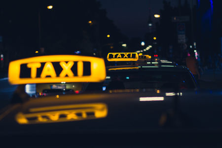 taxi sign at night - taxi cars
