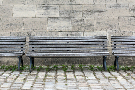 wooden bench on the street - empty seatの写真素材
