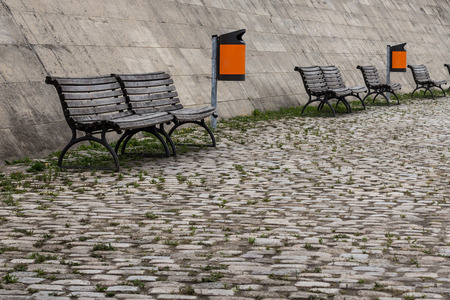 urban furniture - wooden bench  and trash cansの写真素材