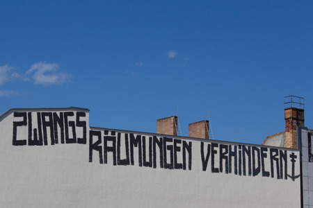 Berlin, Germany - June 14, 2016: "Stop evictions" (german: Zwangsraeumung verhindern) graffiti on building facade in Berlin, Germany.のeditorial素材