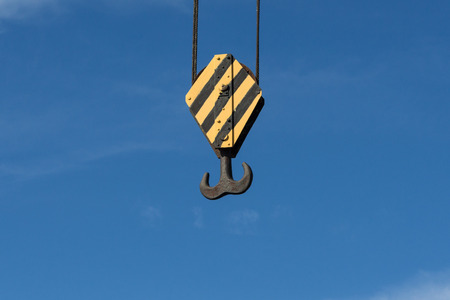 crane hook closeup on blue sky background