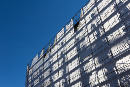 construction industry  building with scaffolding silhouetteのeditorial素材