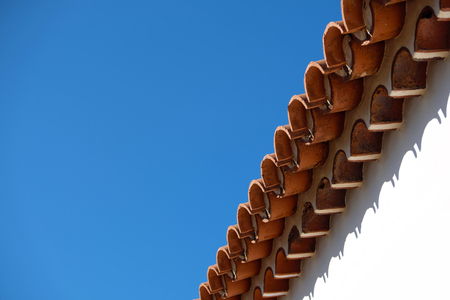 vintage roof tiles, blue sky, copy space - roofing