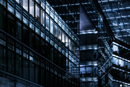 office building facade at night, city lights
