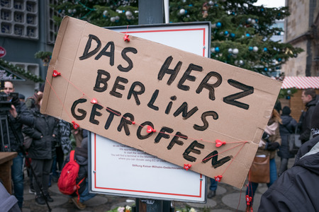 Berlin, Germany - december 20, 2016: A sign saying "Das Herz Berlins ist getroffen" ( The heart of Berlin is hit) at the Christmas Market in Berlin, the day after the terrorist attack.のeditorial素材