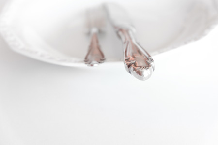 empty plate with knife and fork - beautiful cutleryの写真素材