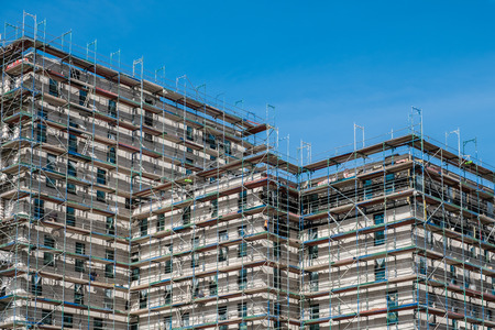 building construction site with scaffolding - building industry