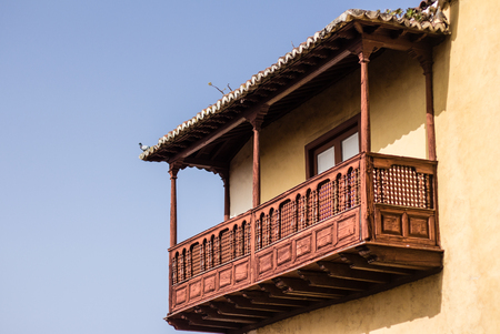 beautiful wooden balcony on traditional house in spainの写真素材