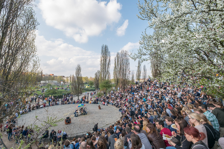 People at Wall Park watching the sundays karaoke show in Berlin, Germany.のeditorial素材