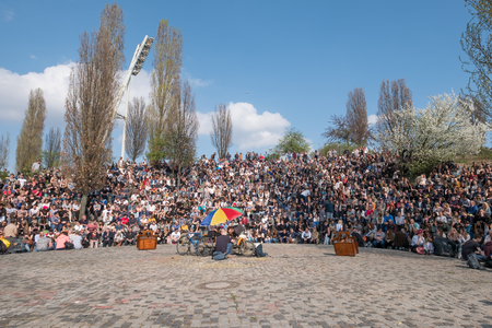 People at Wall Park watching the sundays karaoke show in Berlin, Germany.のeditorial素材