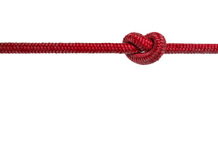 red rope with knot - knotted rope on white backgroundの写真素材