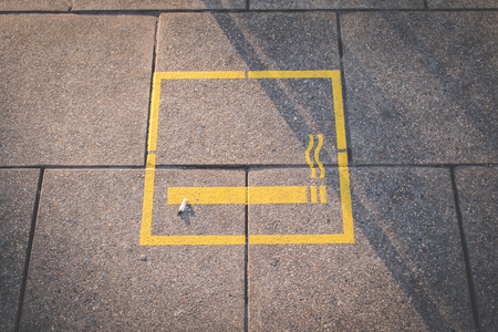 Cigarette and smoking area symbol on floorの写真素材