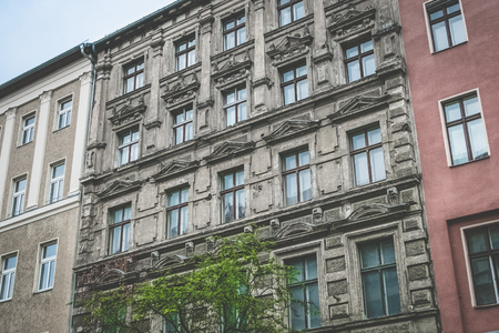 unsanitary old building facade - apartment building exterior Berlinの写真素材