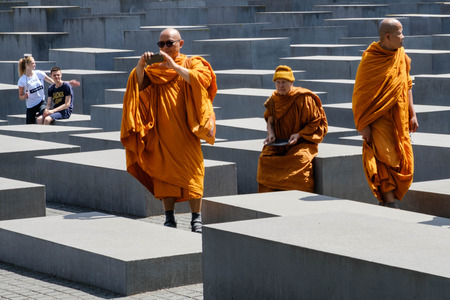 Berlin, Germany - june 9, 2017: Buddhist monks visiting the Memorial of the Murdered Jews in Europe a.k.a. the Holocaust memorial in Berlin, Germany.のeditorial素材