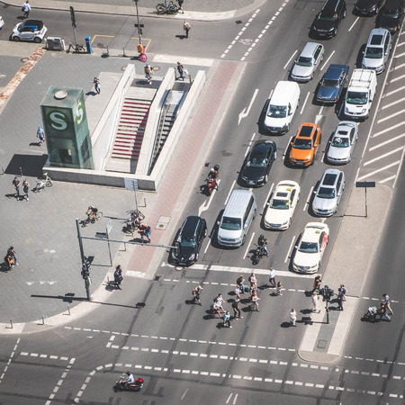 Berlin, Germany - june 9, 2017: Aerial of a crossroad / street traffic with cars and people at...