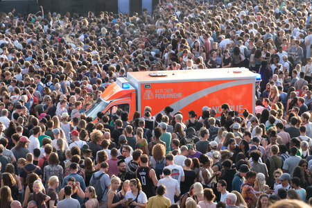 Berlin, Germany - june 21, 2017: Emergency transporter / ambulance inside crowd of people at "fete de la musique" in Berlin, Germany.のeditorial素材