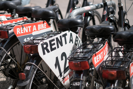 rent a bike - row of rental bicyclesの写真素材