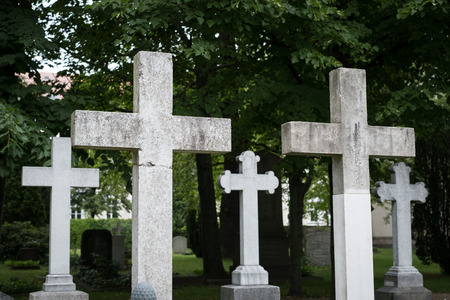 Stone cross gravestones on cemetery / graveyardの写真素材