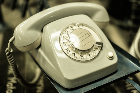 old telephone, phone with dial plate - plastic phoneの写真素材