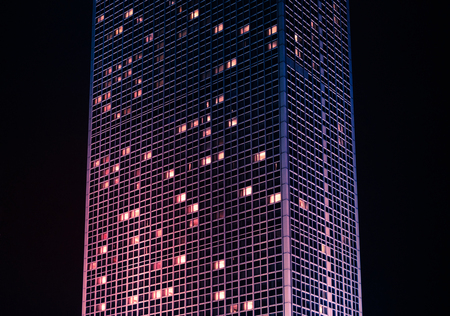 tall skyscraper building at night - modern building exteriorの写真素材