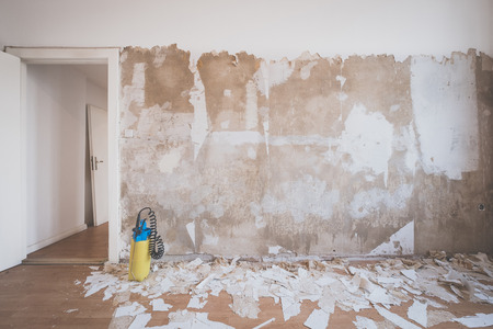 peeling wallpaper from apartment room wall  -の写真素材