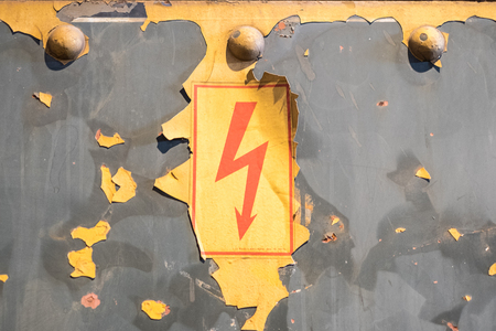 flash symbol, old warning sign, cution -electricity on vintage background