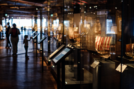 People inside the German Museum of Technology looking at ship models.のeditorial素材