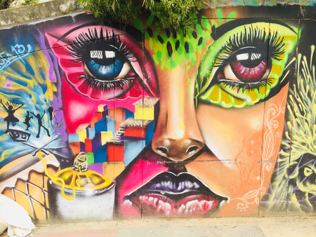 Graffiti mural paintings in the streets of Comuna 13 in Medellin, Colombia.のeditorial素材