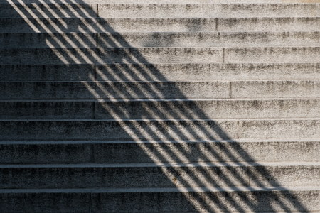 shadow on stairway outdoor - concrete stairs with sunlight and diagonal shadowの写真素材