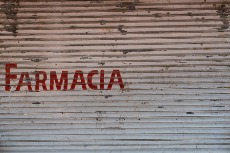 Farmacia (pharmacy) written on closed storefront storefront in Panama City, Avenida Centralのeditorial素材