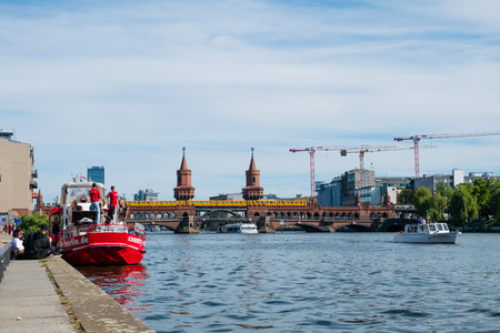River, boats and Oberbaum Bridge in Berlin on a summer dayのeditorial素材