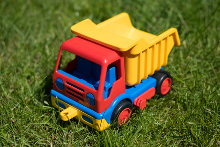 toy truck model on meadow - dumper carの写真素材