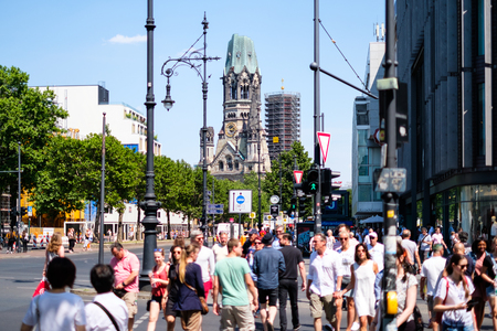 People crossing street at Berlin`s most famous shopping avenue, the Kurfuerstendamm aka Kudamm on a summer dayのeditorial素材