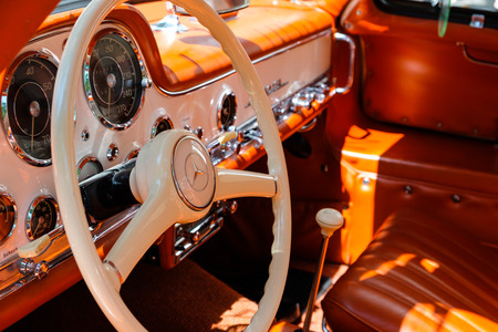 Steering wheel, dashboard and interior of a beautiful vintage car cockpit at Classic Days, a classic...