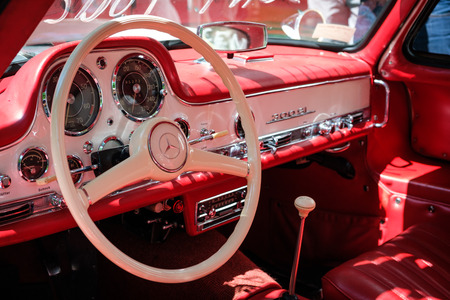 Steering wheel, dashboard and interior of a beautiful vintage car cockpit at Classic Days, a classic...