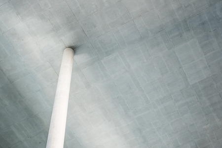column under ceiling - concrete construction concept backgroundの写真素材
