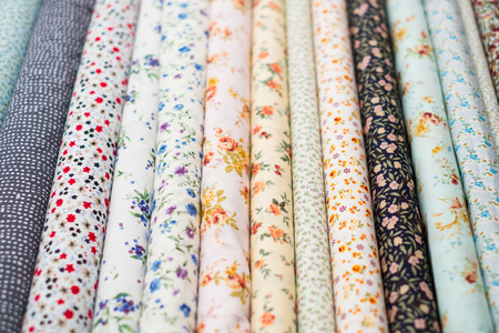 fabric rolls with floral pattern on textile market -の写真素材