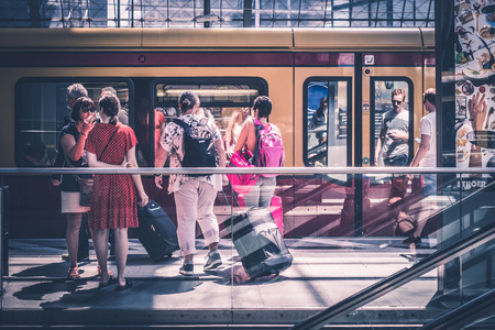 Traveling people with luggage at main train station (Hauptbahnhof) in Berlin, Germanyのeditorial素材
