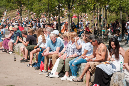 Berlin, Germany - july 2018: Many people sitting together drinking in crowded Park (Mauerpark) on a sunny summer dayのeditorial素材