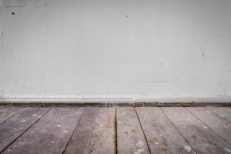 wooden floor and dirty wall - apartment construction concept  background  -の写真素材
